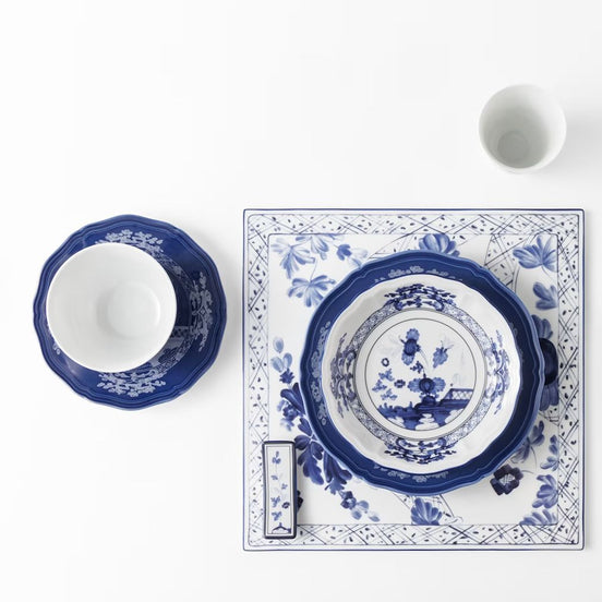 Bring refined ease to social dining with the Ginori 1735 Oriente Italiano Indaco appetizer plates set of 2, handcrafted in Sesto Fiorentino, Italy. Fashioned from pure Italian porcelain, this versatile pair pairs an intricate indigo-blue botanical design with a luminous white surface, blending Florentine ceramic heritage with modern aperitivo and tasting rituals.