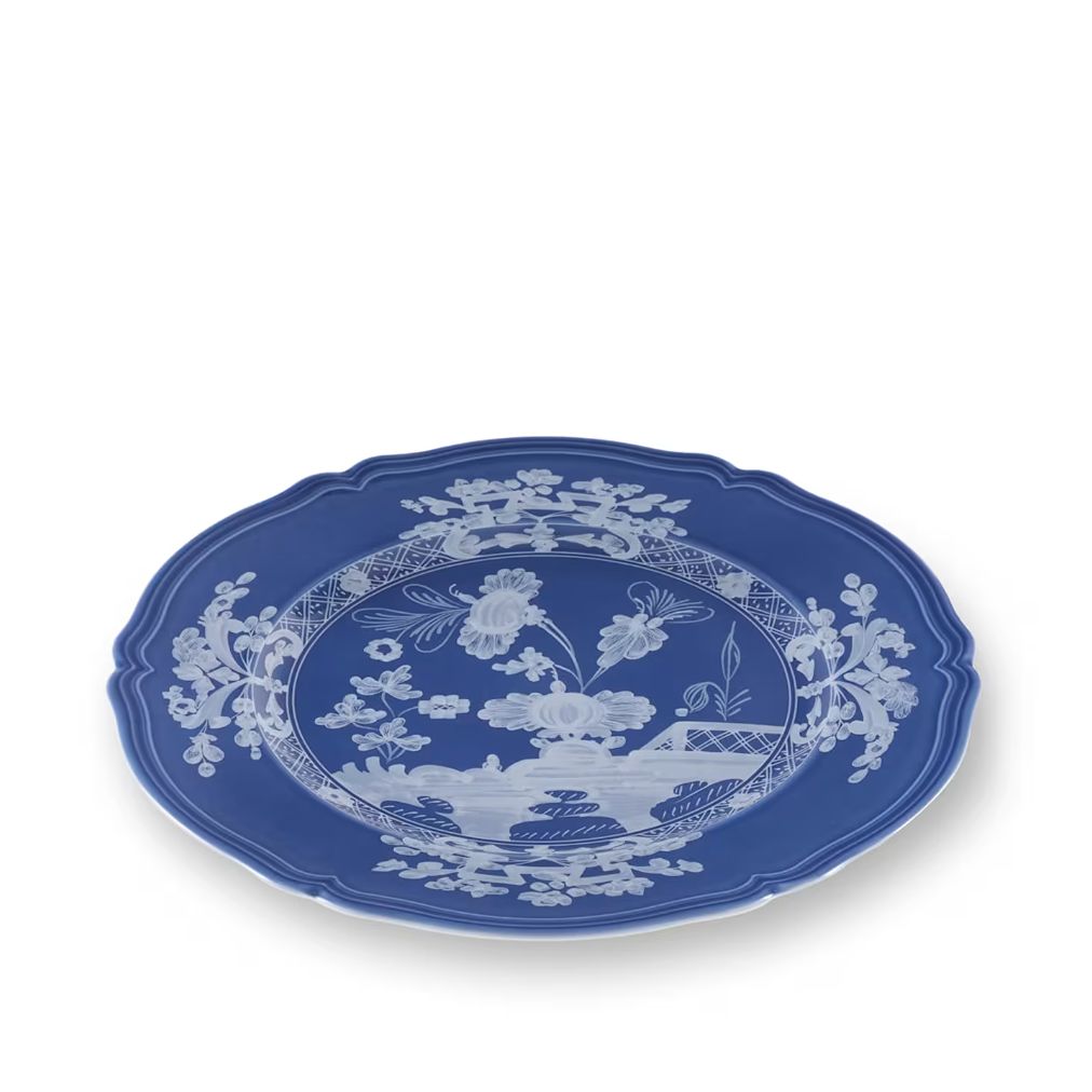 A blue and white porcelain serving platter with a decorative floral and landscape pattern, shown on a clean white background.