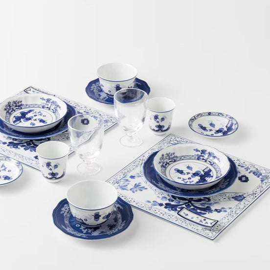Bring timeless versatility to your dining table with the Ginori 1735 Oriente Italiano Indaco large bowls set of 2, handcrafted in Sesto Fiorentino, Italy. Cast in the archival Antico Doccia silhouette, this pure Italian porcelain pair features an intricate indigo-blue botanical motif gracefully blooming across a luminous white ground, combining Florentine artisanal heritage with effortless modern utility.