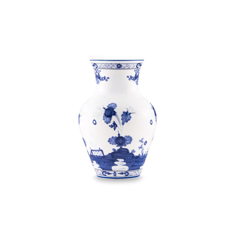 A classic blue and white porcelain vase featuring hand-painted floral and landscape motifs, set against a solid white background.