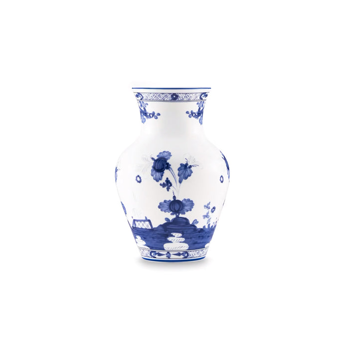 A classic blue and white porcelain vase featuring hand-painted floral and landscape motifs, set against a solid white background.