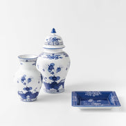 Make a striking interior statement with the Ginori 1735 Oriente Italiano Indaco Ming vase, handcrafted in Sesto Fiorentino, Italy. Sculpted from pure Italian porcelain, this iconic vessel features delicate indigo-blue floral carnations unfurling across a luminous white surface, uniting classical Florentine ceramic heritage with the timeless poise of historic Asian silhouettes.