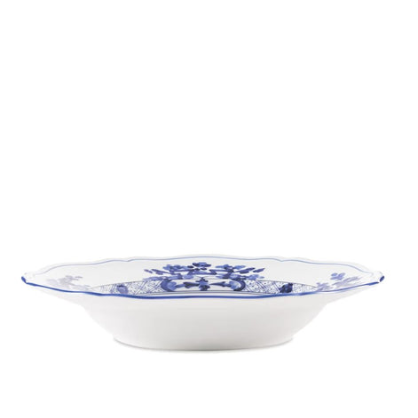A white ceramic bowl with a scalloped rim, decorated with a blue floral and crest pattern, shown against a plain white background.