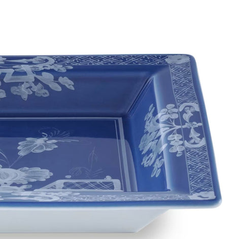 Shop the Ginori 1735 Oriente Italiano Indaco large change tray in pure porcelain. Handcrafted in Italy with iconic floral motif.
