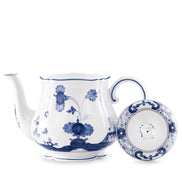 Anchor your tea ritual with the Ginori 1735 Oriente Italiano Indaco teapot, handcrafted in Sesto Fiorentino, Italy. Sculpted in the archival Antico Doccia shape, this pure Italian porcelain centerpiece showcases an intricate indigo-blue botanical motif blooming across a luminous white surface, uniting classical Florentine ceramic heritage with an evocative, Far Eastern-inspired garden aesthetic.