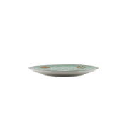 A round ceramic plate with a pale mint green and white floral pattern and small gold accents, shown against a plain white background.