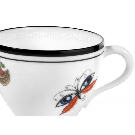 A white porcelain coffee cup with a black rim, featuring a colorful butterfly illustration with blue and orange wings on the side.