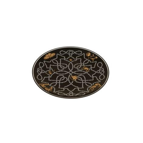 An oval black rug featuring an intricate white geometric pattern and scattered gold floral accents, shown against a plain white background.
