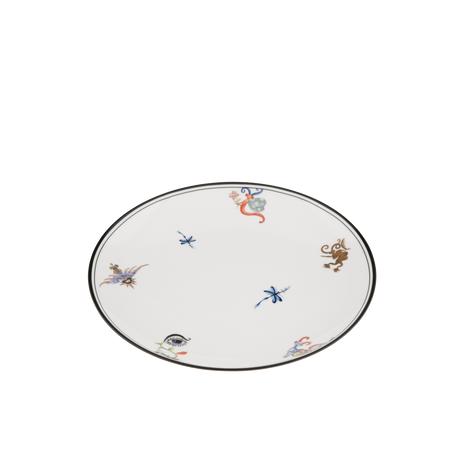 An oval white ceramic plate with a thin black rim, decorated with small, scattered hand-painted traditional Chinese motifs including a red monkey, blue dragonflies, and a brown monkey.