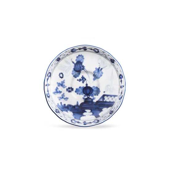 Complete your fine beverage service with the Ginori 1735 Oriente Italiano Indaco tea saucer, handcrafted in Sesto Fiorentino, Italy. Cast in the heritage Antico Doccia shape, this pure Italian porcelain piece frames the tea ritual with a delicate indigo-blue floral pattern set against a luminous white field, blending Florentine ceramic mastery with Far Eastern aesthetic harmony.