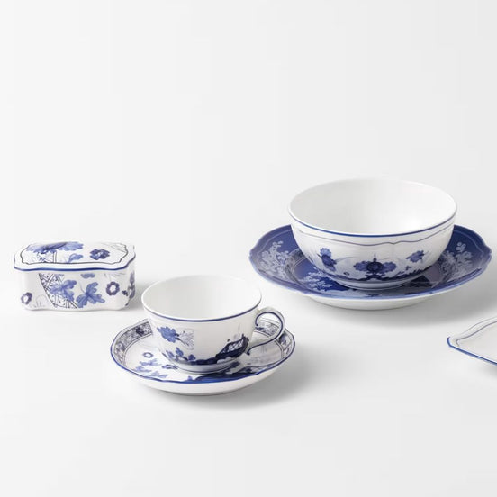 Complete your fine beverage service with the Ginori 1735 Oriente Italiano Indaco tea saucer, handcrafted in Sesto Fiorentino, Italy. Cast in the heritage Antico Doccia shape, this pure Italian porcelain piece frames the tea ritual with a delicate indigo-blue floral pattern set against a luminous white field, blending Florentine ceramic mastery with Far Eastern aesthetic harmony.
