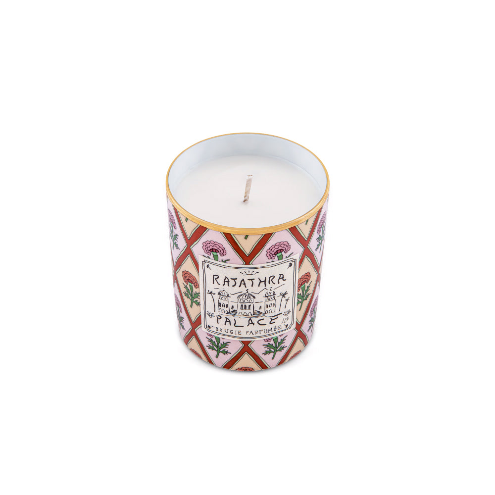Transport your senses to the royal palaces of Rajasthan with the Rajathra Palace Scented Candle from the Profumi Luchino Collection by Ginori 1735. Inspired by one of the imaginary destinations cherished by British artist and designer Luke Edward Hall, this luxury home fragrance captures the elegance, mystery, and opulence of refined oriental interiors.