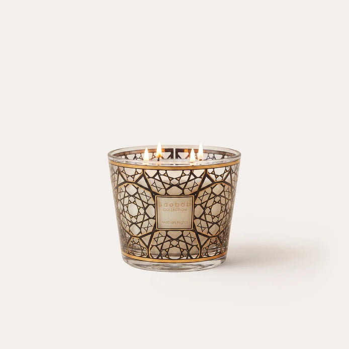 Limited edition Baobab Collection Arabian Nights scented candle with a rich woody fragrance of saffron, oud, and incense. Decorative glass with 24-carat gold detailing, available in Max 10 and Max 16 sizes for elegant home fragrance and sophisticated interiors. Archideco Interior Gallery | archideco-interior.com