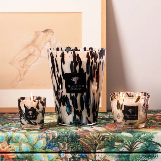Limited edition Baobab Collection Black Pearls scented candle with hand-blown glass and the brand's iconic fragrance of ginger and black rose. Available in Max 10, Max 16, and Max 24 sizes for elegant home fragrance and sophisticated interiors. Archideco Interior Gallery | archideco-interior.com