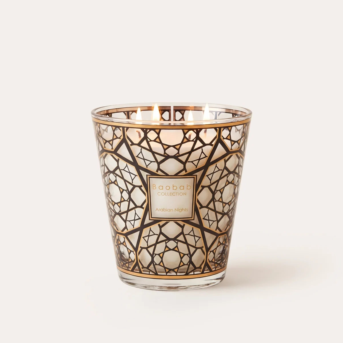 Limited edition Baobab Collection Arabian Nights scented candle with a rich woody fragrance of saffron, oud, and incense. Decorative glass with 24-carat gold detailing, available in Max 10 and Max 16 sizes for elegant home fragrance and sophisticated interiors. Archideco Interior Gallery | archideco-interior.com
