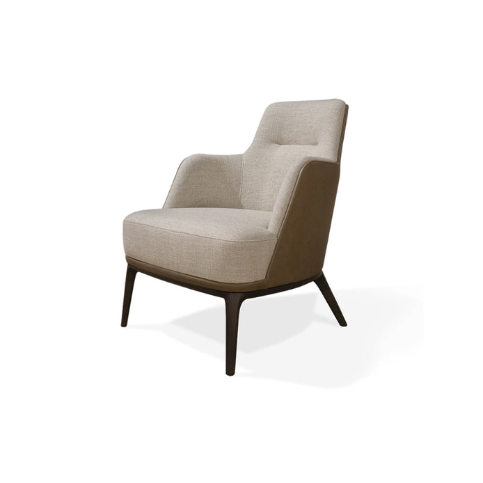 The Anita Armchair by Medea 1905, designed as part of the Tara Bernerd for Medea 1905 Collection, combines generous upholstered comfort with a refined wooden base and a softly architectural silhouette.