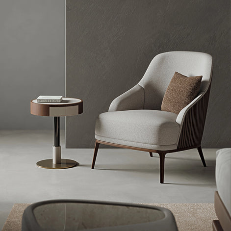 The Anita Armchair by Medea 1905, designed as part of the Tara Bernerd for Medea 1905 Collection, combines generous upholstered comfort with a refined wooden base and a softly architectural silhouette.