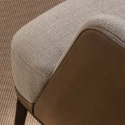 The Anita Armchair by Medea 1905, designed as part of the Tara Bernerd for Medea 1905 Collection, combines generous upholstered comfort with a refined wooden base and a softly architectural silhouette.
