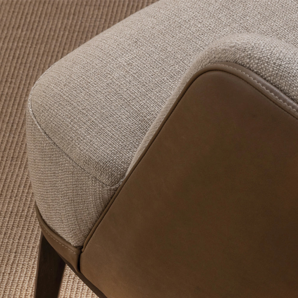 The Anita Armchair by Medea 1905, designed as part of the Tara Bernerd for Medea 1905 Collection, combines generous upholstered comfort with a refined wooden base and a softly architectural silhouette.