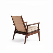 The Eloisa Chair by Medea 1905, designed as part of the Tara Bernerd for Medea 1905 Collection, brings together a sculptural wooden frame, a naturally woven straw backrest, and tactile leather upholstery to create a distinctive expression of contemporary Italian craftsmanship.