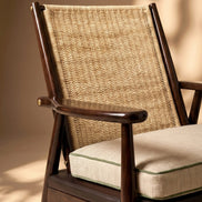 The Eloisa Chair by Medea 1905, designed as part of the Tara Bernerd for Medea 1905 Collection, brings together a sculptural wooden frame, a naturally woven straw backrest, and tactile leather upholstery to create a distinctive expression of contemporary Italian craftsmanship.