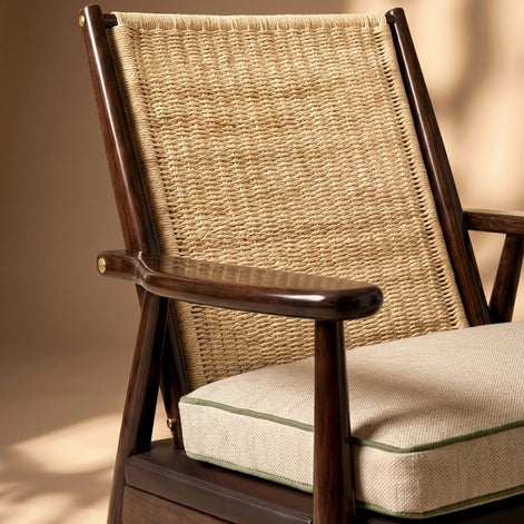 The Eloisa Chair by Medea 1905, designed as part of the Tara Bernerd for Medea 1905 Collection, brings together a sculptural wooden frame, a naturally woven straw backrest, and tactile leather upholstery to create a distinctive expression of contemporary Italian craftsmanship.