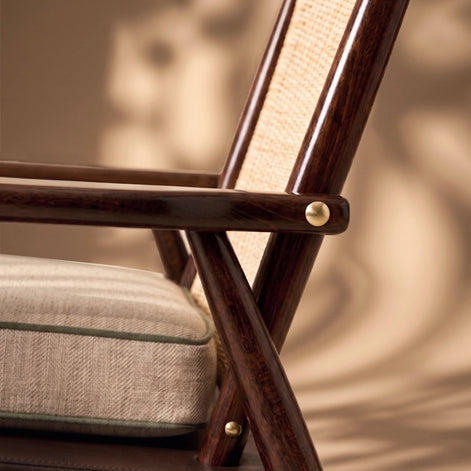 The Eloisa Chair by Medea 1905, designed as part of the Tara Bernerd for Medea 1905 Collection, brings together a sculptural wooden frame, a naturally woven straw backrest, and tactile leather upholstery to create a distinctive expression of contemporary Italian craftsmanship.