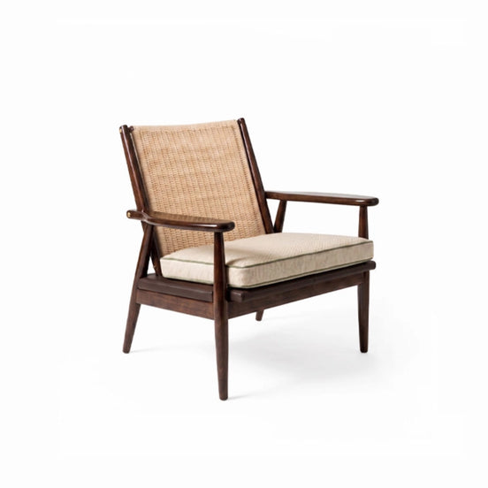 The Eloisa Chair by Medea 1905, designed as part of the Tara Bernerd for Medea 1905 Collection, brings together a sculptural wooden frame, a naturally woven straw backrest, and tactile leather upholstery to create a distinctive expression of contemporary Italian craftsmanship.
