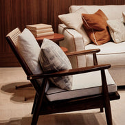 The Eloisa Chair by Medea 1905, designed as part of the Tara Bernerd for Medea 1905 Collection, brings together a sculptural wooden frame, a naturally woven straw backrest, and tactile leather upholstery to create a distinctive expression of contemporary Italian craftsmanship.