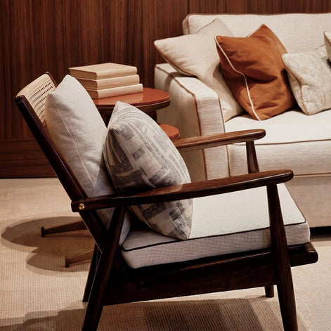 The Eloisa Chair by Medea 1905, designed as part of the Tara Bernerd for Medea 1905 Collection, brings together a sculptural wooden frame, a naturally woven straw backrest, and tactile leather upholstery to create a distinctive expression of contemporary Italian craftsmanship.