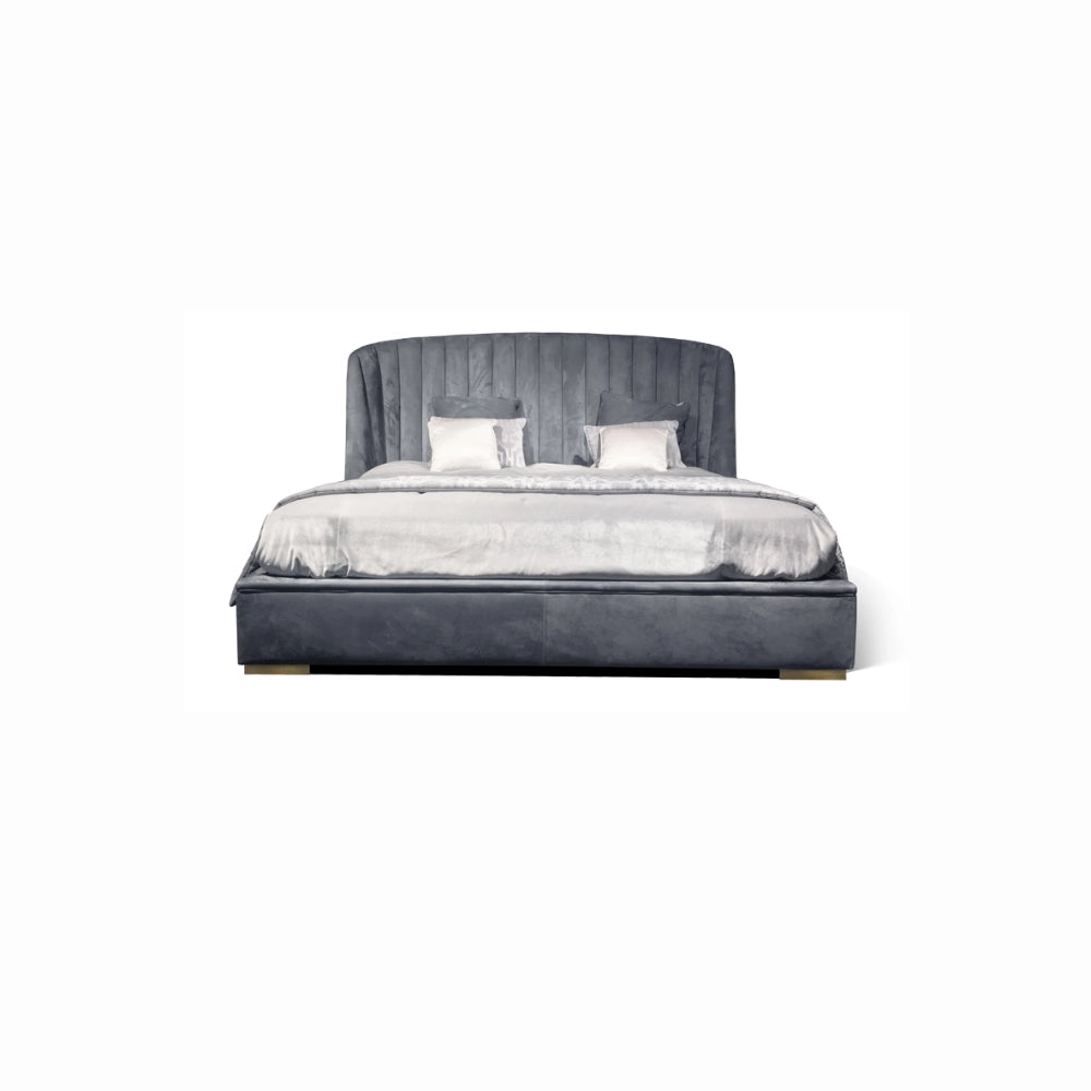 The Empire Bed by Medea 1905 embodies the essence of contemporary Italian living through refined craftsmanship, enveloping volumes, and luxurious materiality. Its signature wingback headboard, defined by elegant vertical channel stitching, rises in a graceful curve that gently wraps the sleeping area, creating a sense of intimacy