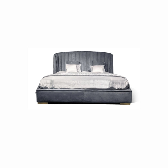 The Empire Bed by Medea 1905 embodies the essence of contemporary Italian living through refined craftsmanship, enveloping volumes, and luxurious materiality. Its signature wingback headboard, defined by elegant vertical channel stitching, rises in a graceful curve that gently wraps the sleeping area, creating a sense of intimacy
