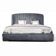 The Empire Bed by Medea 1905 embodies the essence of contemporary Italian living through refined craftsmanship, enveloping volumes, and luxurious materiality. Its signature wingback headboard, defined by elegant vertical channel stitching, rises in a graceful curve that gently wraps the sleeping area, creating a sense of intimacy