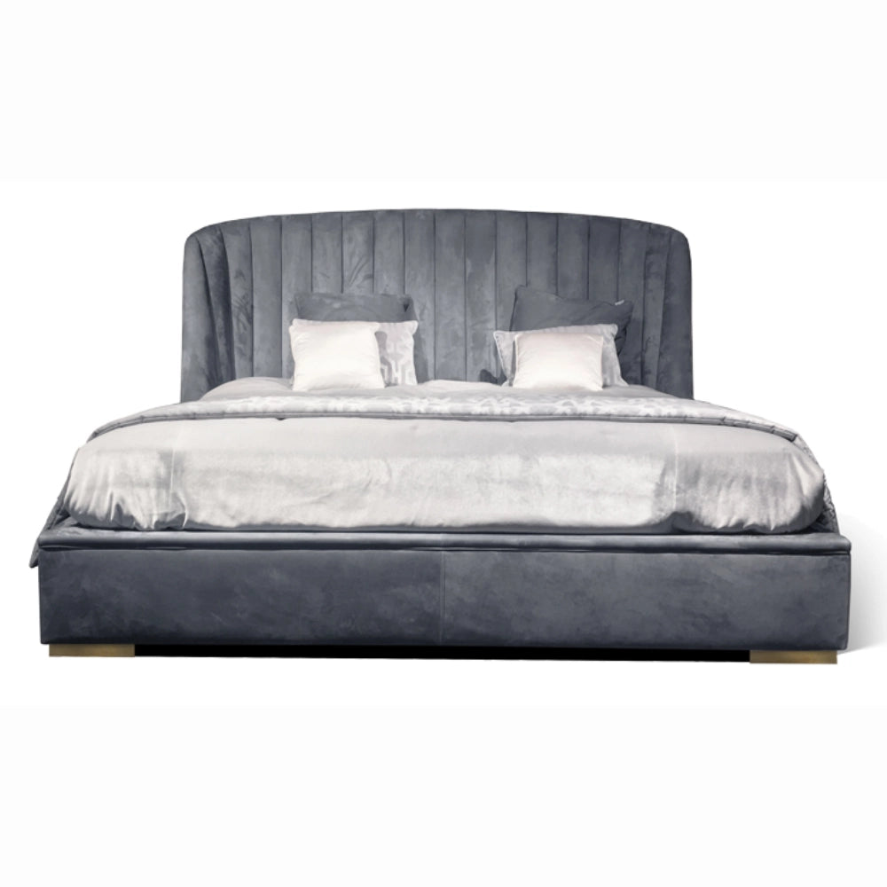 The Empire Bed by Medea 1905 embodies the essence of contemporary Italian living through refined craftsmanship, enveloping volumes, and luxurious materiality. Its signature wingback headboard, defined by elegant vertical channel stitching, rises in a graceful curve that gently wraps the sleeping area, creating a sense of intimacy