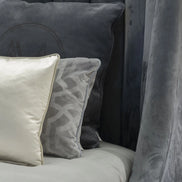 The Empire Bed by Medea 1905 embodies the essence of contemporary Italian living through refined craftsmanship, enveloping volumes, and luxurious materiality. Its signature wingback headboard, defined by elegant vertical channel stitching, rises in a graceful curve that gently wraps the sleeping area, creating a sense of intimacy