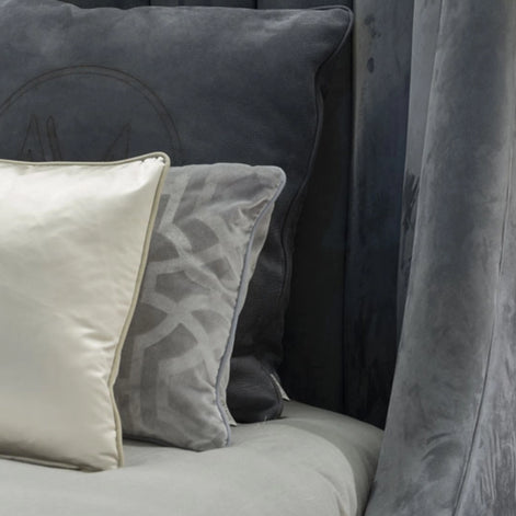 The Empire Bed by Medea 1905 embodies the essence of contemporary Italian living through refined craftsmanship, enveloping volumes, and luxurious materiality. Its signature wingback headboard, defined by elegant vertical channel stitching, rises in a graceful curve that gently wraps the sleeping area, creating a sense of intimacy