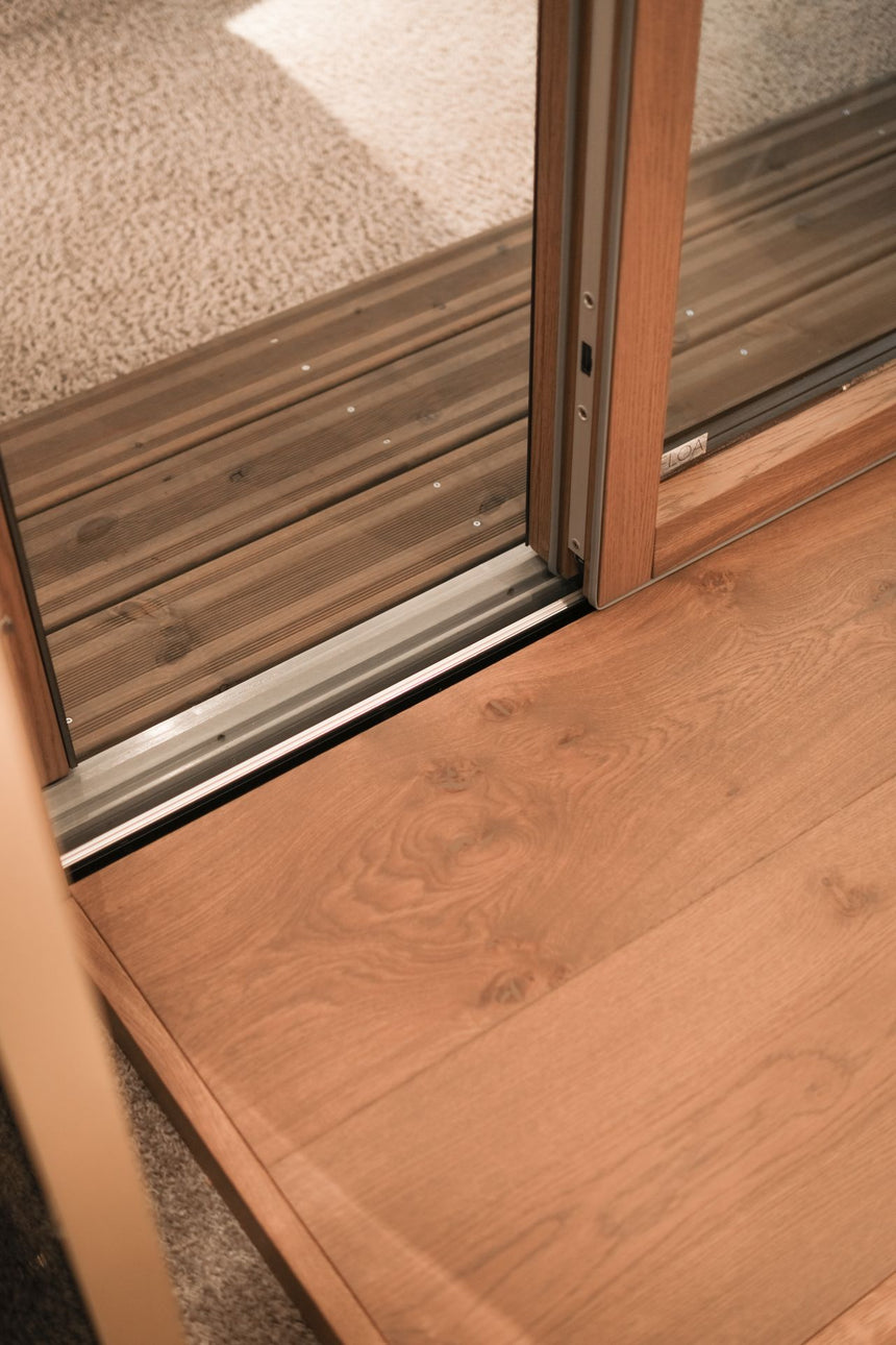 Discover FLOA, the Passivhaus-certified wood-aluminium lift-and-slide system designed for contemporary architecture. Create seamless indoor-outdoor living with panoramic glazing, minimal frames, exceptional thermal performance and expert project specification support from Archideco. Available for project specification and volume orders.